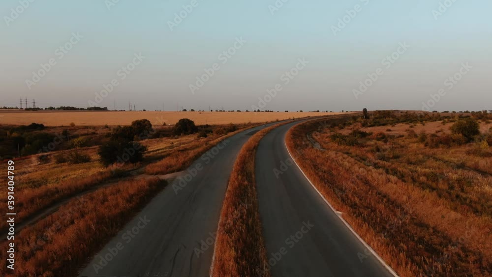 Landscape view on a beautiful country road at the end of the summer, 4k Landscape view on a beautiful country road at the end of the summer, 4k