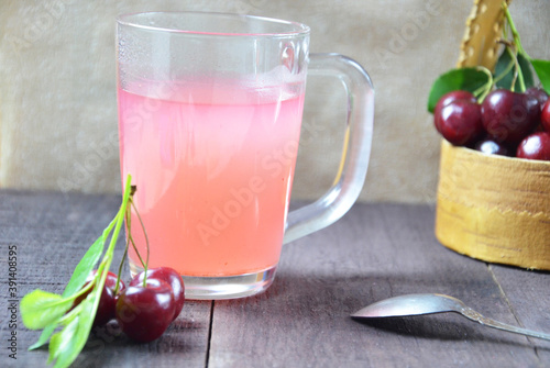 Wallpaper Mural Kissel with cherries in a glass on an old wooden background, traditional russia or poland drink, berry jelly, mousse, summer pink drink Torontodigital.ca