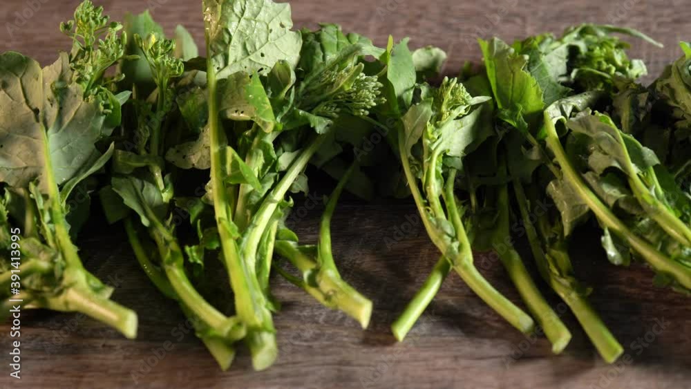 Slider to the left of beautifully lit closeup broccoli rabe, rapini. Slider to the left of beautifully lit closeup broccoli rabe, rapini.