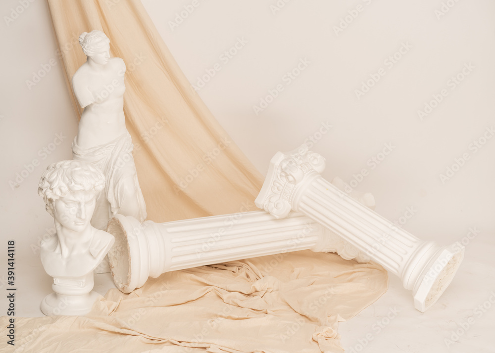 Ταπετσαρία Renaissance epoch gypsum statues arranged with fabric on white background