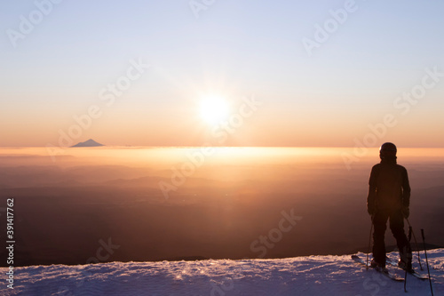 View of Mount Taranaki from Turoa Skifield  skier in background  winter season  New Zealand