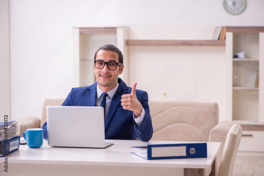 Young male employee working from home in pandemic concept Young male employee working from home in pandemic concept