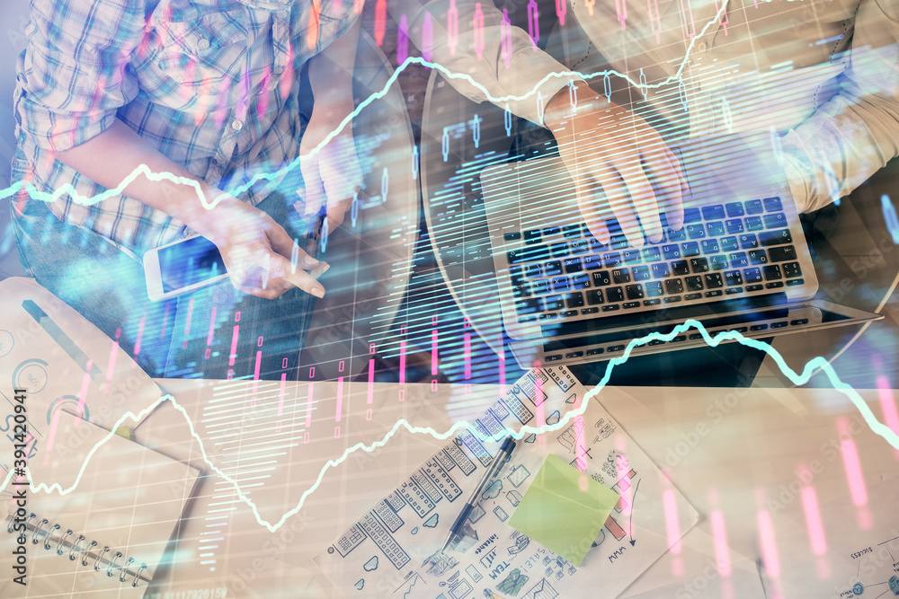 Multi exposure of man and woman working together and forex graph hologram drawing. Financial analysis concept. Computer background. Top View. Multi exposure of man and woman working together and forex graph hologram drawing. Financial analysis concept. Computer background. Top View.