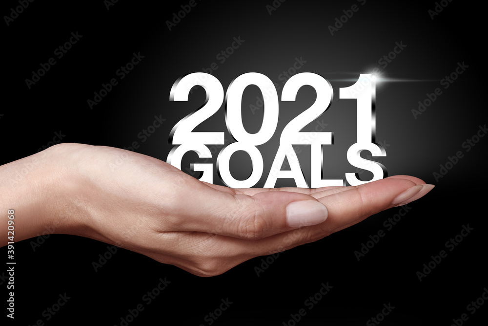 New Year goals 2021 with hand. New Year goals 2021 with hand.