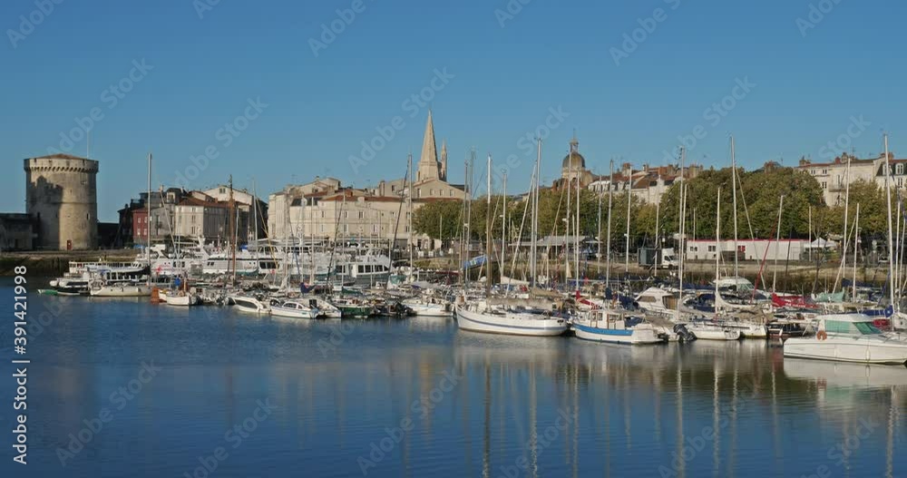 La Rochelle,Charente Maritime department, Region Nouvelle Aquitaine, France. View of the old harbour. On the right side is the Grosse Horloge tower, on the left side are the harbour towers.