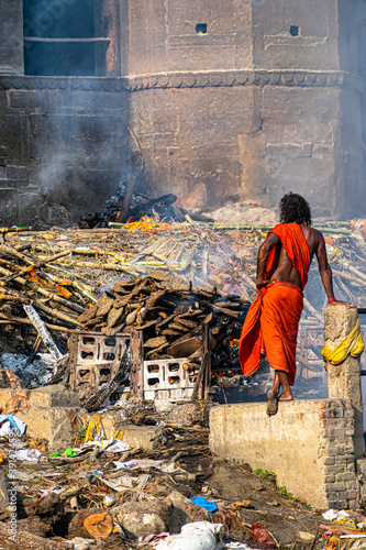 an indian monk(aghori) satanding at the holy Manikarnika ghat at Varanasi,Cremation ceremony in Manikarnika photo