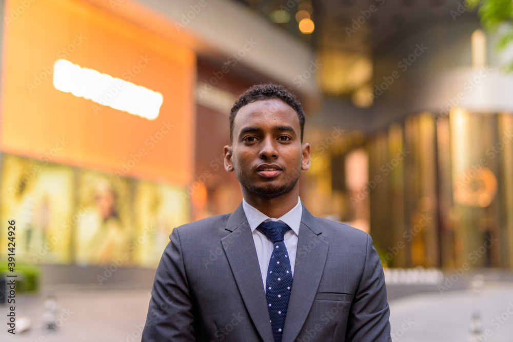 Face of young handsome African businessman outdoors Face of young handsome African businessman outdoors