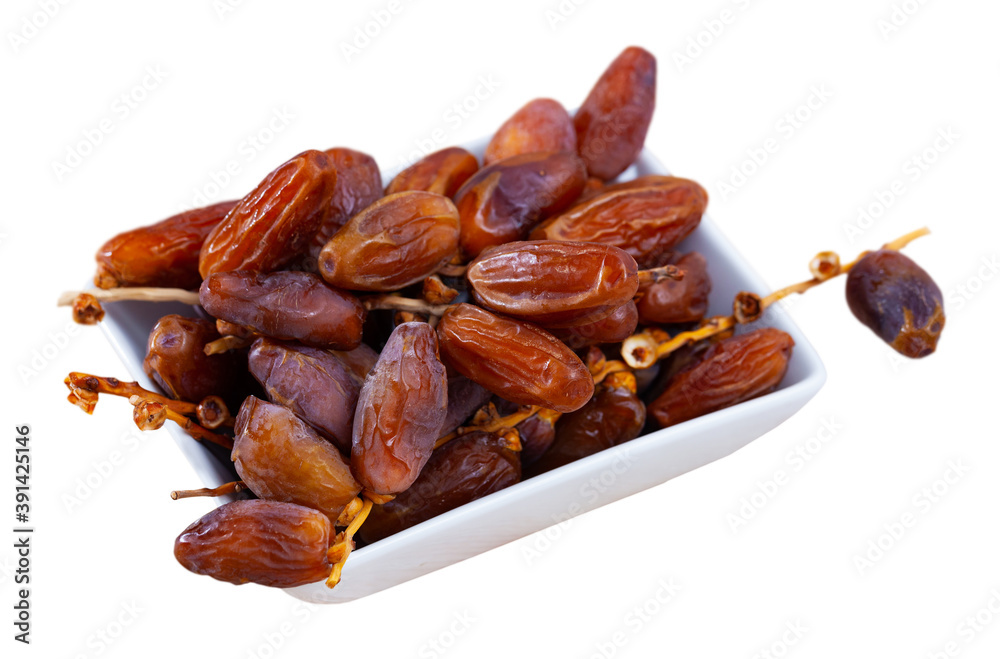 Tasty dried date close up, traditional mediterranean fruit. Isolated over white background