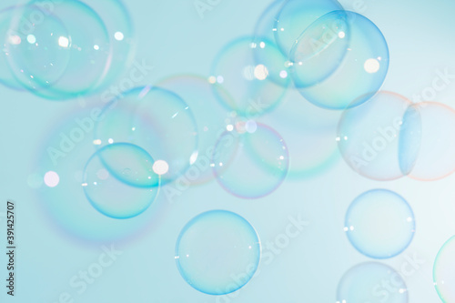 Beautiful shiny colorful soap bubbles texture background. Abstract, Natural fresh soapy summer green background.