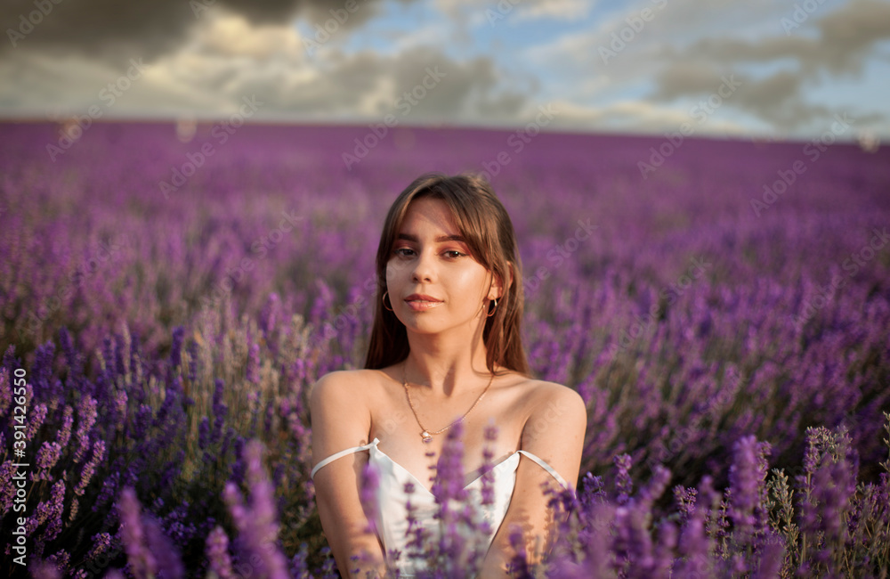 beautiful young woman on lavender field