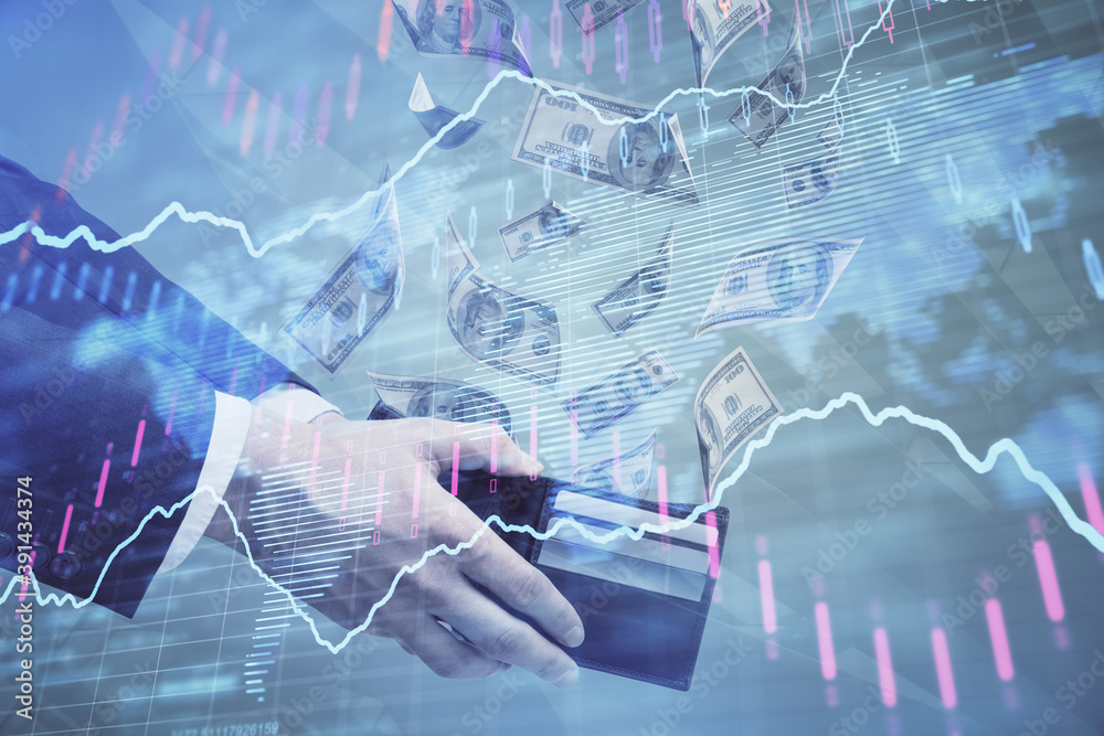 Multi exposure of financial graph drawing hologram and USA dollars bills and man hands. Analysis concept. Multi exposure of financial graph drawing hologram and USA dollars bills and man hands. Analysis concept.