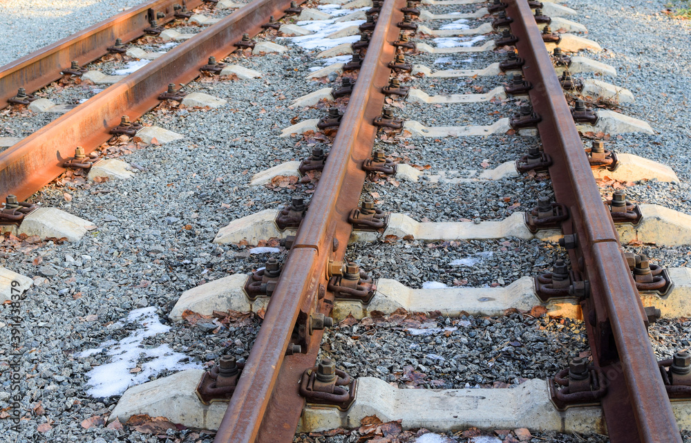 Image of an empty railroad track stretching far away. Narrow gauge railway. Image of an empty railroad track stretching far away. Narrow gauge railway.