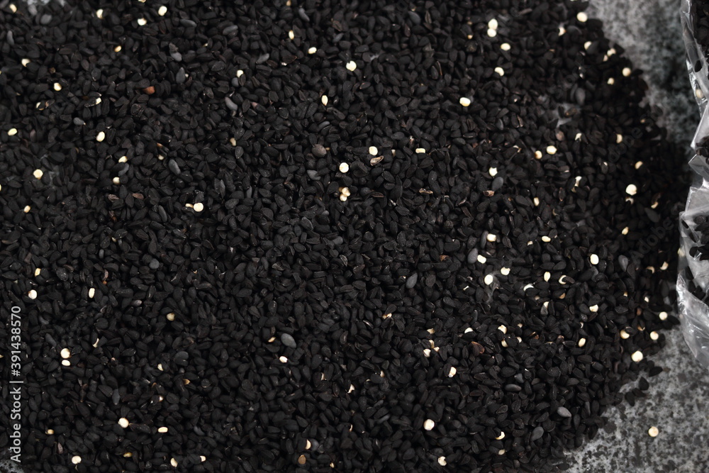 Background of black cumin seeds. Directly Above.