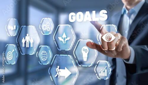Goal achievement concept. Man presses his finger on a virtual screen.