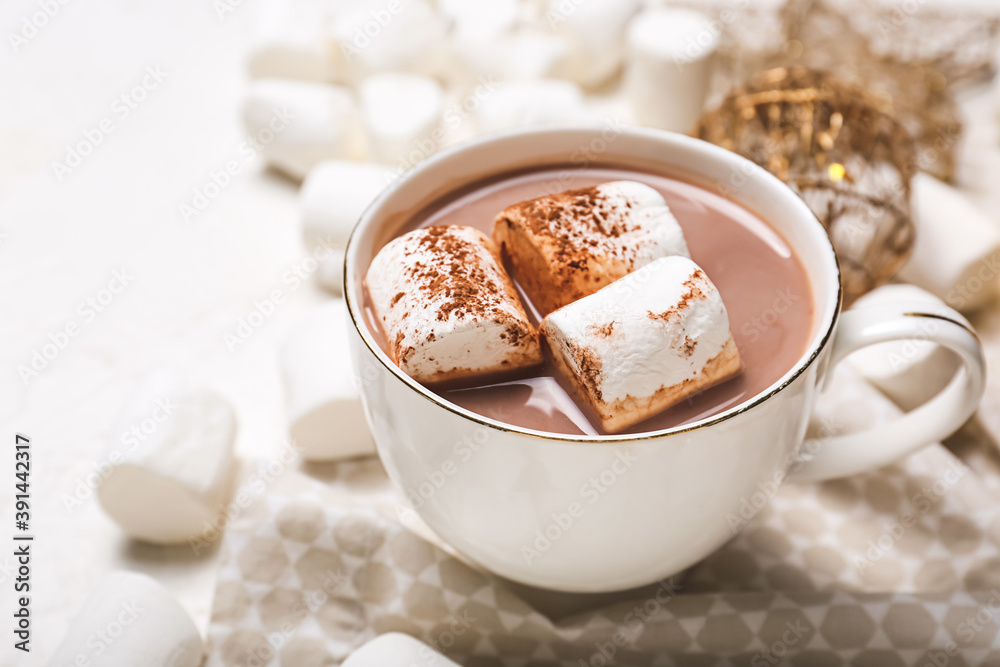 Cup of hot cacao drink with marshmallows on table Cup of hot cacao drink with marshmallows on table