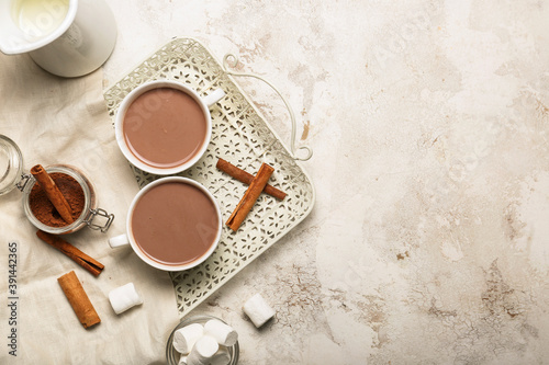 Cups of hot cacao drink wit...