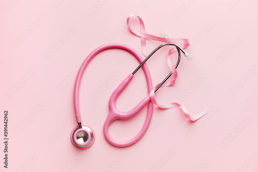 Pink ribbon and stethoscope on color background. Breast cancer awareness concept Pink ribbon and stethoscope on color background. Breast cancer awareness concept