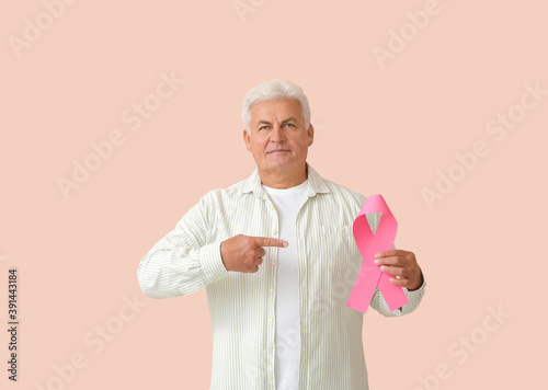 Mature man with pink ribbon...