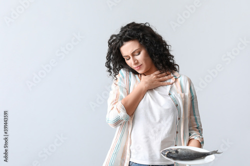 Young woman with food aller...