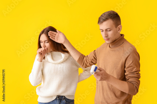 Man measuring temperature o...