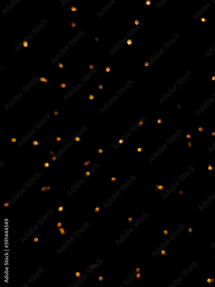 The golden side's or boke on a black background. Merry Christmas and happy New Year. Christmas background. The golden side's or boke on a black background. Merry Christmas and happy New Year. Christmas background.