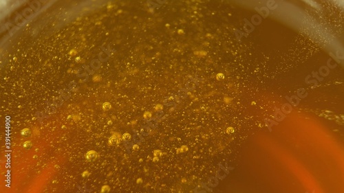 Stirring Natural Bee Honey With Teaspoon Close Up