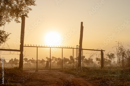 Iron door in morning sunrise in the autumn