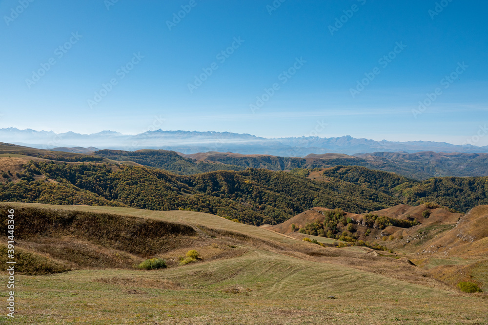 Elbrus And Green Hills At Sunny Summer Day. Elbrus Region, North Caucasus, Russia Elbrus And Green Hills At Sunny Summer Day. Elbrus Region, North Caucasus, Russia