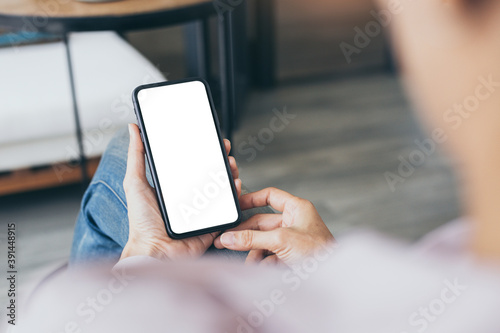 cell phone blank white screen mockup.woman hand holding texting using mobile on desk at office.background empty space for advertise.work people contact marketing business,technology