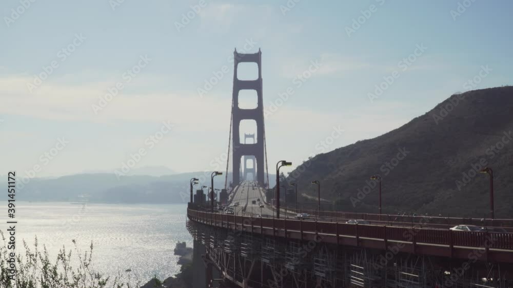 Sunny Day at Golden Gate Bridge With Busy People and Cars Passing By in San Francisco, California. Sunny Day at Golden Gate Bridge With Busy People and Cars Passing By in San Francisco, California.