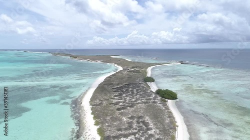 aerial view dolly in carenero island over island Caribbean Sea and white sand beach in Los Roques, Venezuela. photo