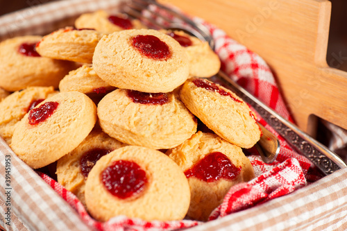 Delicious fresh baked jam drop biscuits, food background. photo