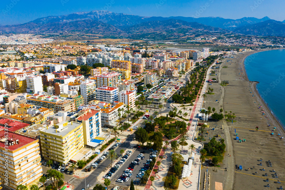Scenic aerial view of Spanish tourist town of Torre del Mar on Mediterranean coast in sunny autumn day, province of Malaga..