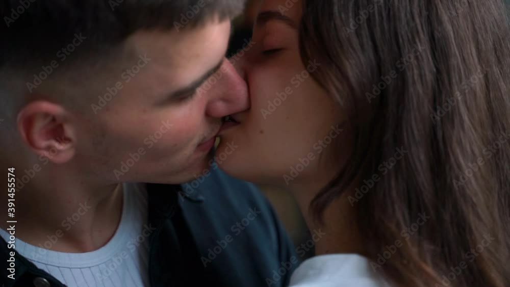 Young woman and man kiss passionately. Close-up. Romantic couple of lovers Young woman and man kiss passionately. Close-up. Romantic couple of lovers
