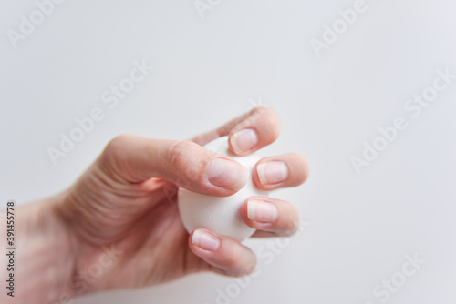 selective focus at the white egg in the hand