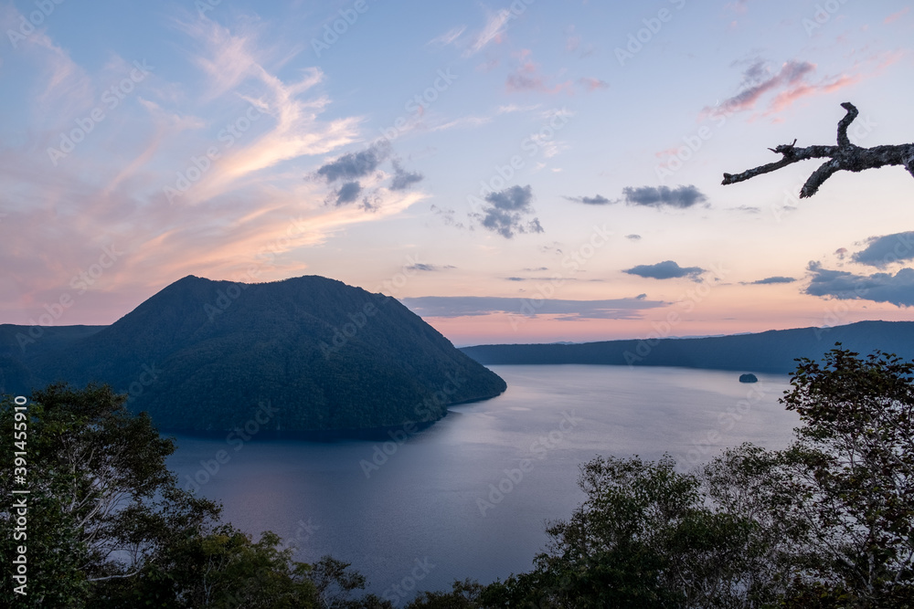 Lake Mashu at dusk with colorful clouds Lake Mashu at dusk with colorful clouds