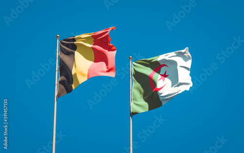 Beautiful national state flags of Algeria and Belgium together at the sky background. 3D artwork concept.