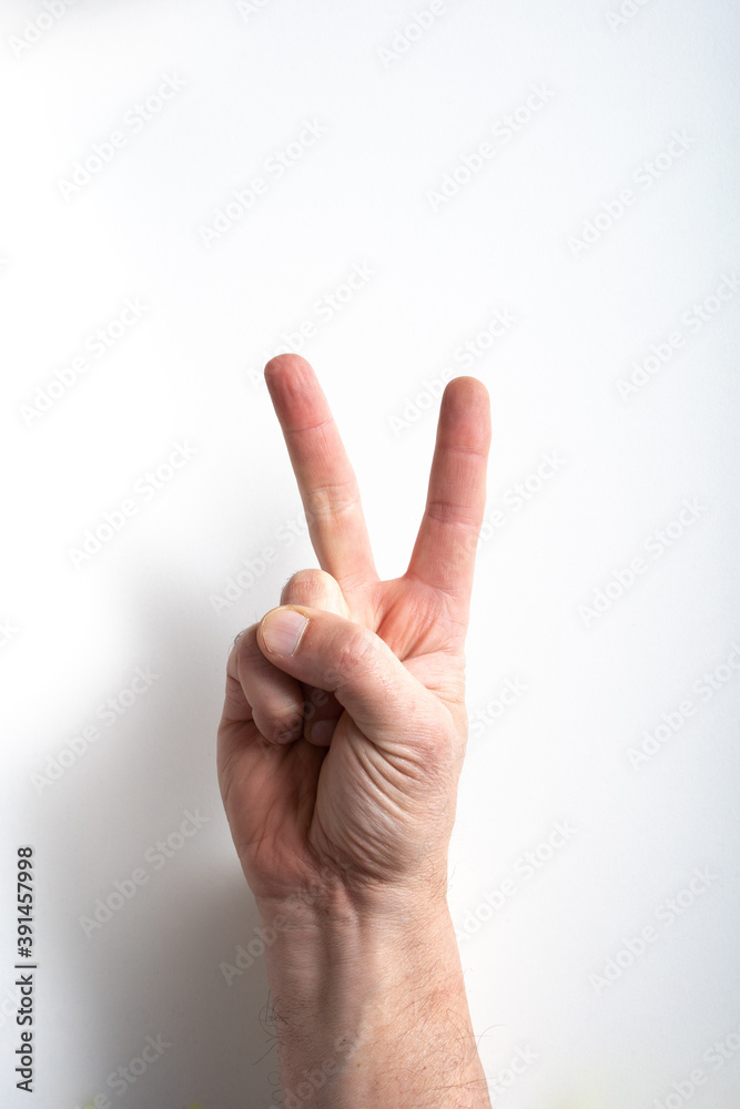 man hand on white background pointing two with fingers. man hand on white background pointing two with fingers.