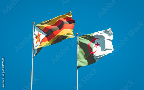 Beautiful national state flags of Zimbabwe and Algeria together at the sky background. 3D artwork concept.