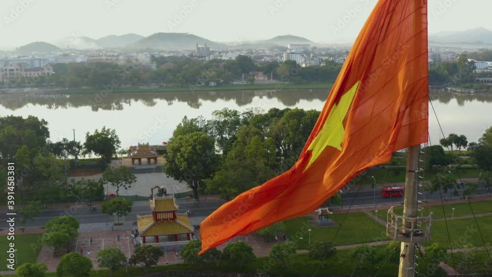 Aerial view of flag tower and Hue Citadel in background. Imperial Palace moat ,Emperor palace complex, Hue city, Vietnam. Travel and landscape concept. Selective focus.