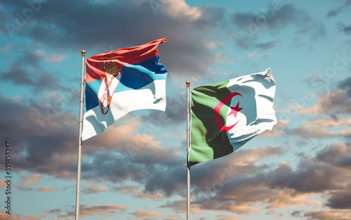 Beautiful national state flags of Serbia and Algeria together at the sky background. 3D artwork concept. © Leo Altman