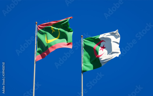 Beautiful national state flags of Mauritania and Algeria together at the sky background. 3D artwork concept.