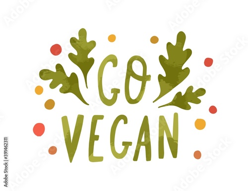 Colorful lettering composition with Go Vegan handwritten inscription decorated with arugula leaves. Motivational hand drawn phrase isolated on white background. Vector illustration