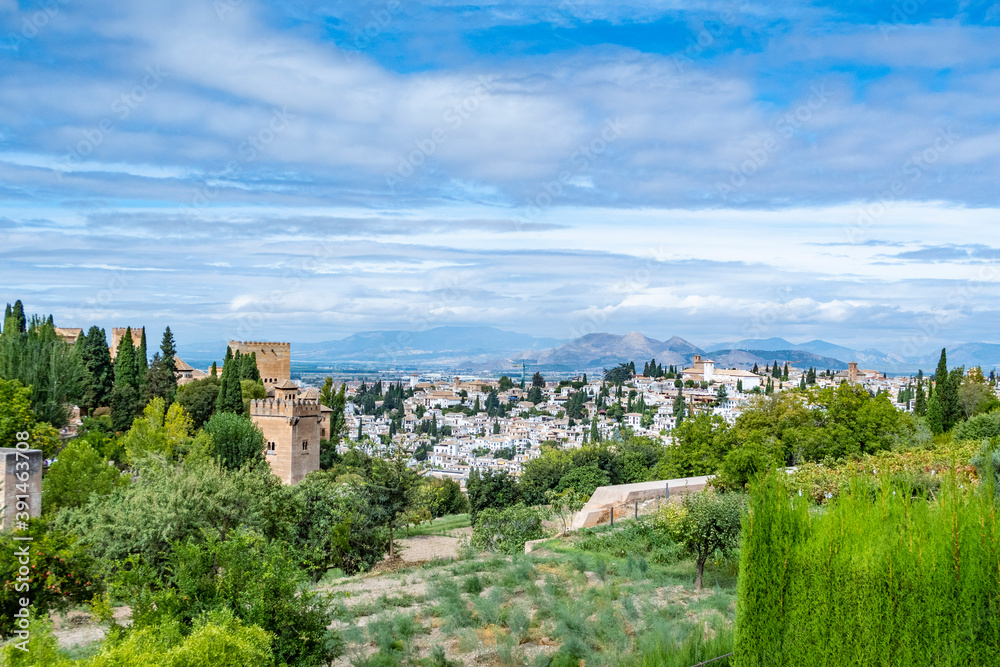 scenic view to Granada with trees and Alhambra