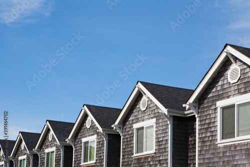 Row of houses, all the same, pitched roof and upstairs window