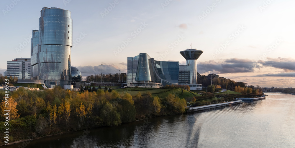 The Government house of the Moscow region is a modern complex of buildings made of metal and concrete, covered with mirror glass. It is located on a well maintained green area on the Moscow river quay