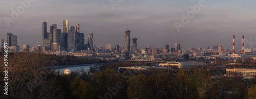 Panoramic view from Vorobyevy gory or Sparrow Hills on the Moscow city business center in the autumn evening. It is a modern complex of skyscrapers on the Moskva River embankment. Evening cityscape.
