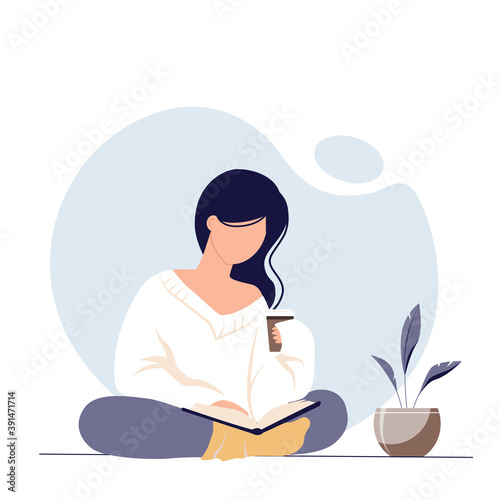 Stylish abstract young woman drinking coffee and reading a book. Beautiful girl in warm cozy clothes.