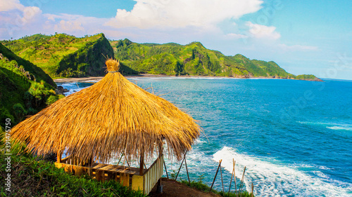 One of the visitors' favorite small huts on the edge of the Tanjung Menguneng cliff, Karang Duwur Village, photo