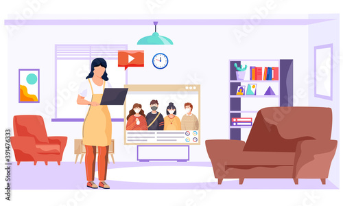 Woman is standing with laptop in the living room near tv and watching video about virus covid-19 and its prevention. Broadcast about the need to prevent the spread of coronavirus. Stay at home